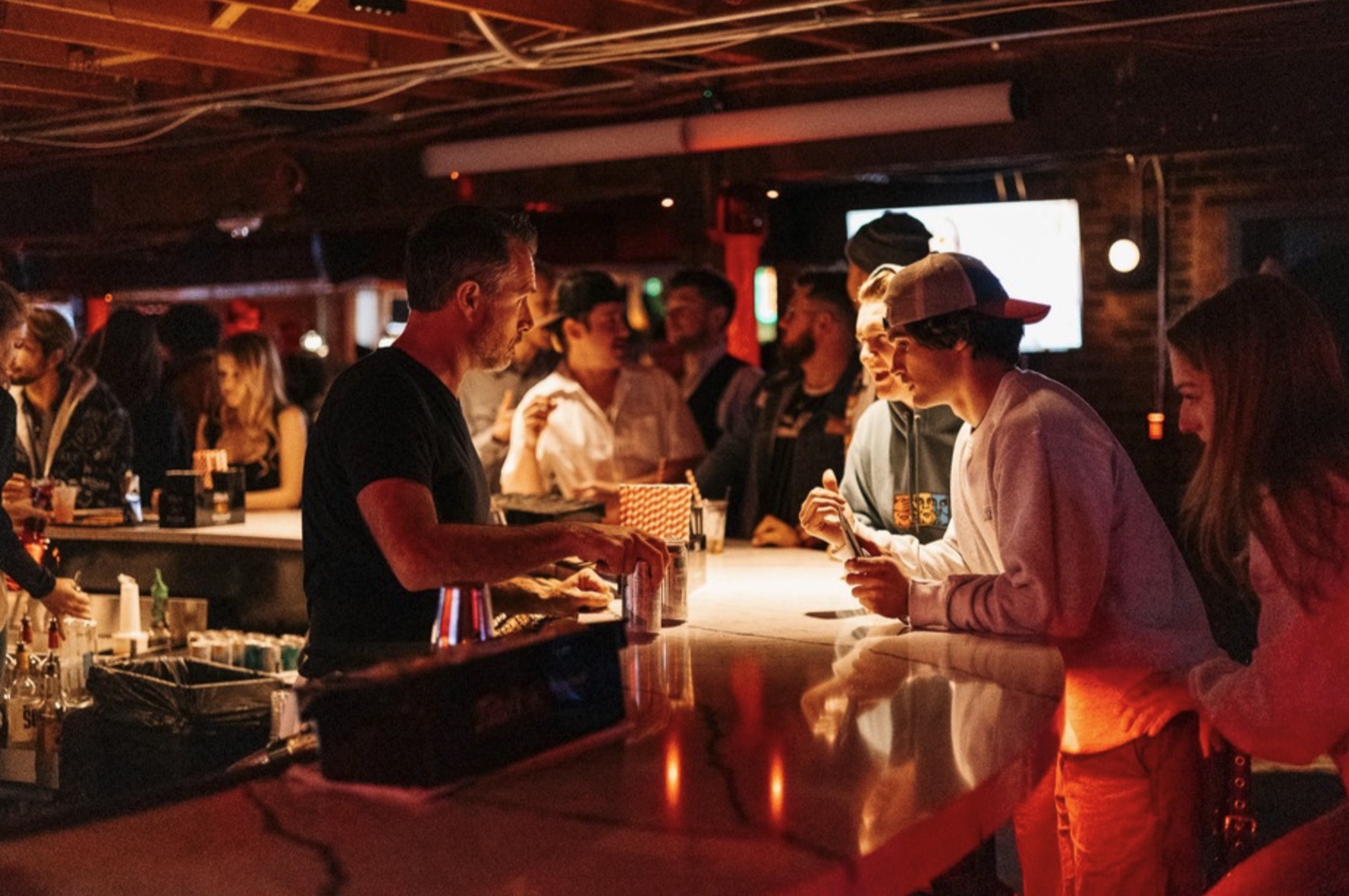 Bartender serving guests at The Spotted James