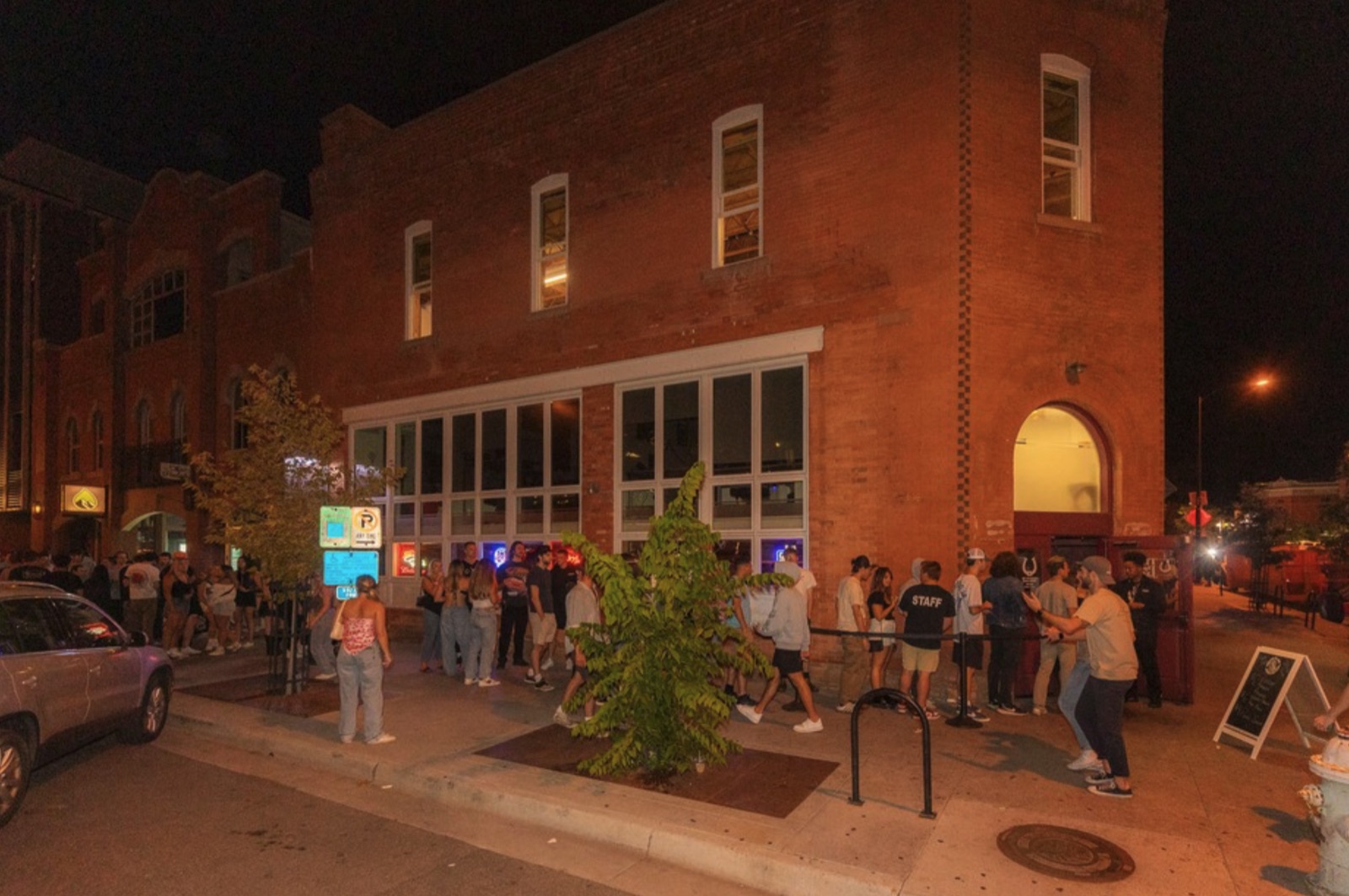 The Spotted James storefront with a line outside