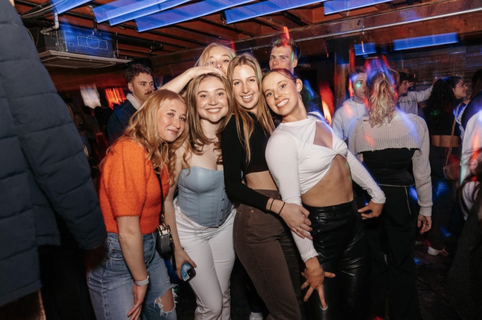 A group of friends celebrating on the dance floor