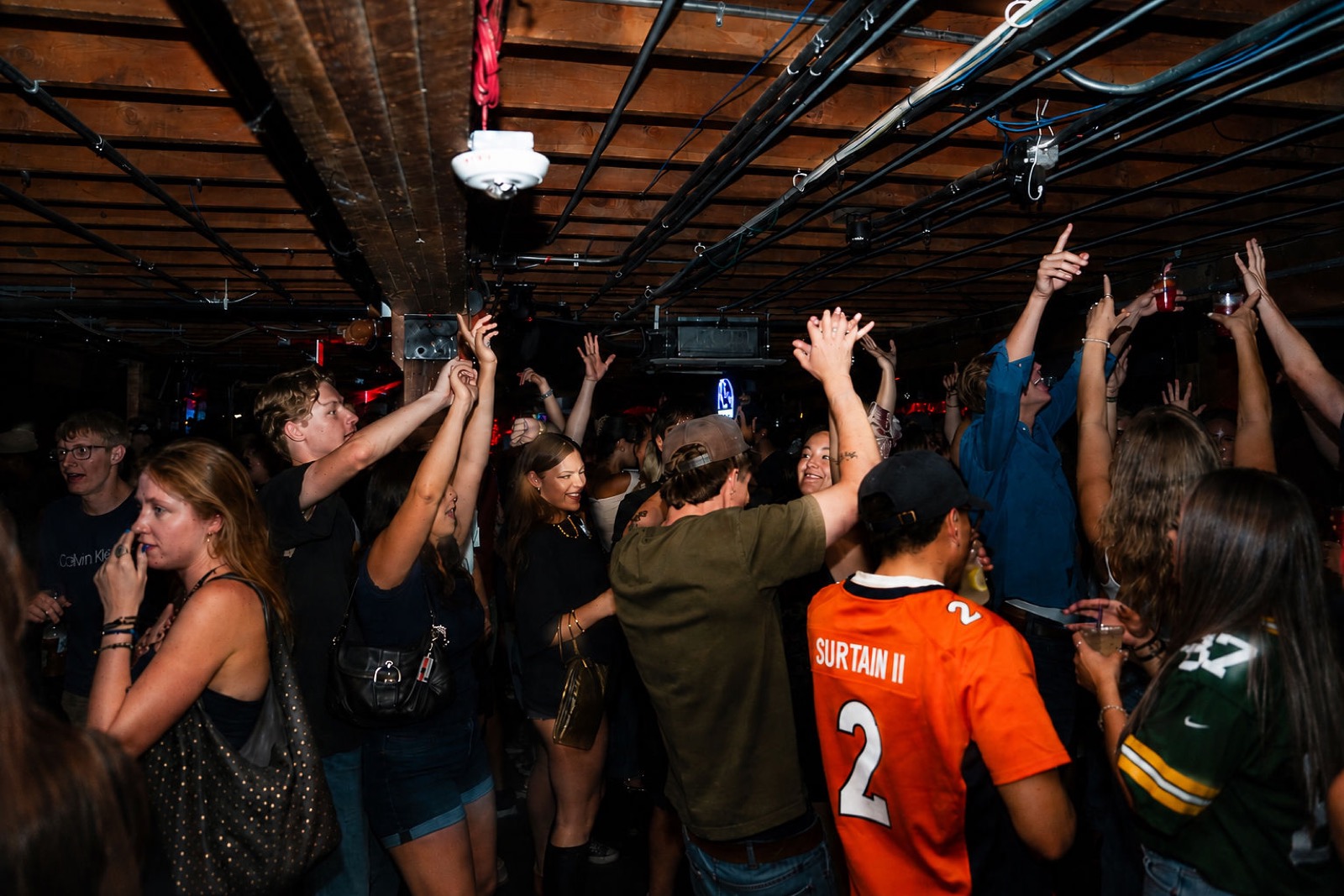 Packed dance floor with the crowd dancing to the DJ