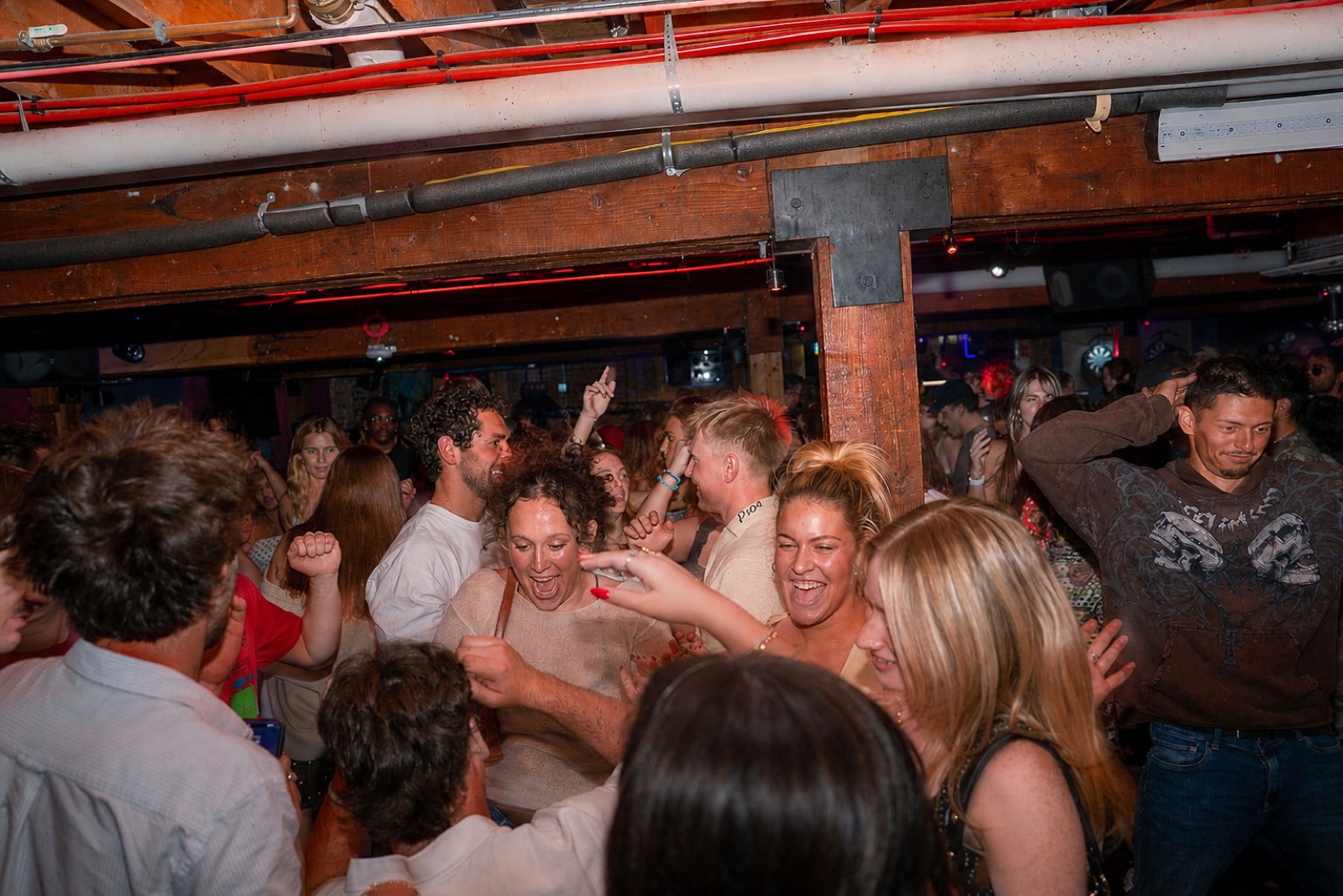 Guests dancing shoulder to shoulder in the main room